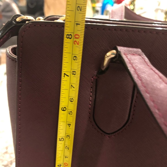 Kate Spade plum medium sized satchel with crossbody strap